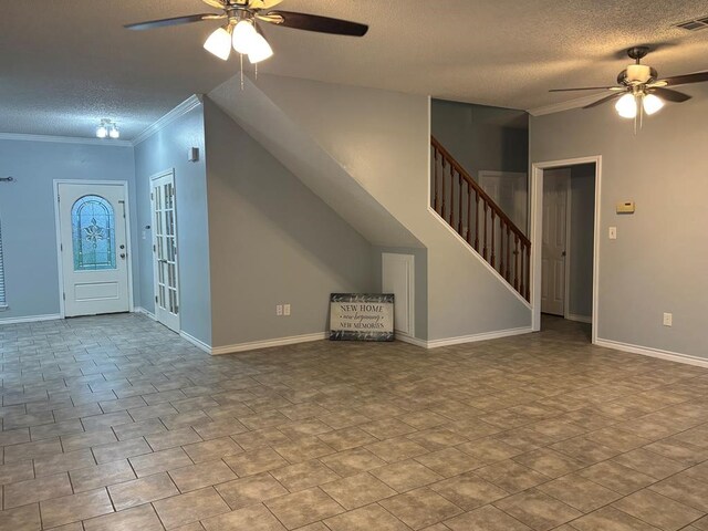 unfurnished living room featuring a textured ceiling, ceiling fan, ornamental molding, and stairs