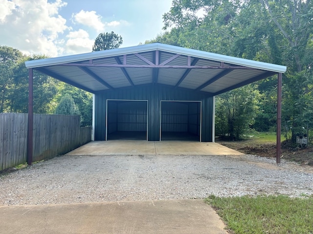 exterior space with fence and a garage