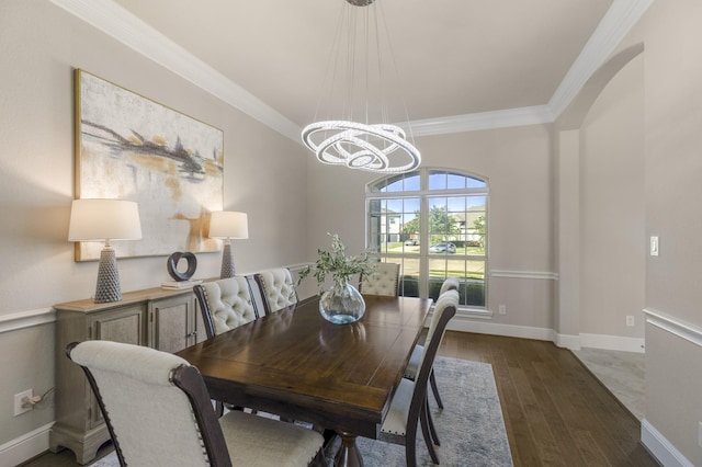 26406 Crimson Bluff Ln, Katy, TX 77494 - dining room featuring a chandelier, baseboards, crown molding, and wood finished floors