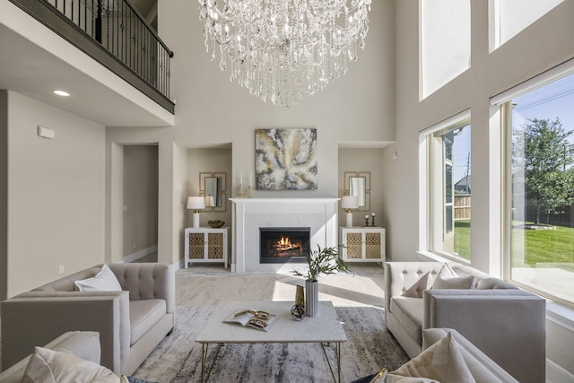 26406 Crimson Bluff Ln, Katy, TX 77494 - living area featuring a towering ceiling, an inviting chandelier, and a healthy amount of sunlight