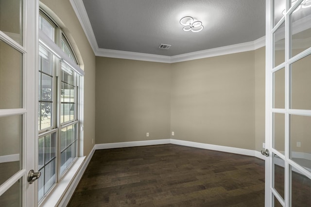 26406 Crimson Bluff Ln, Katy, TX 77494 - spare room featuring crown molding, visible vents, french doors, baseboards, and dark wood-style floors