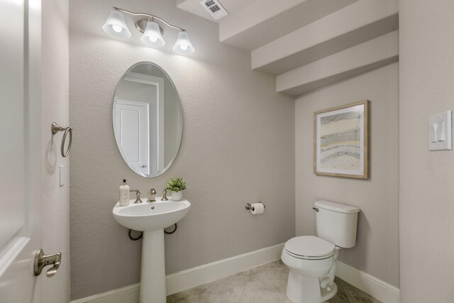 26406 Crimson Bluff Ln, Katy, TX 77494 - half bath with a sink, visible vents, toilet, and baseboards