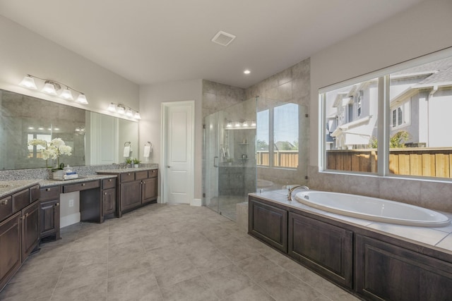 26406 Crimson Bluff Ln, Katy, TX 77494 - bathroom with a garden tub, vanity, visible vents, a stall shower, and tile patterned floors