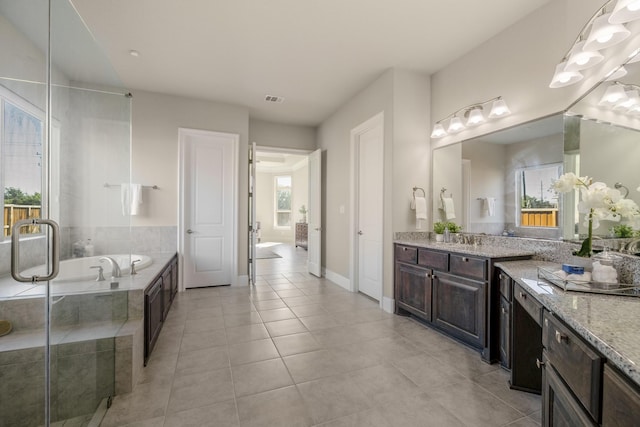 26406 Crimson Bluff Ln, Katy, TX 77494 - full bathroom featuring tile patterned floors, visible vents, baseboards, and a garden tub