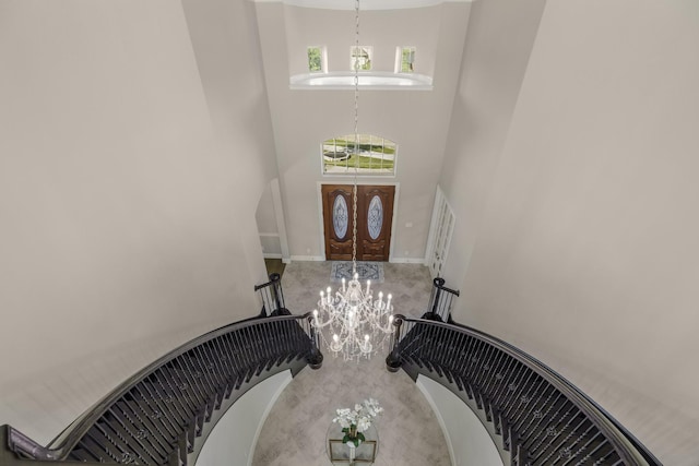 26406 Crimson Bluff Ln, Katy, TX 77494 - foyer featuring a chandelier, a high ceiling, and baseboards