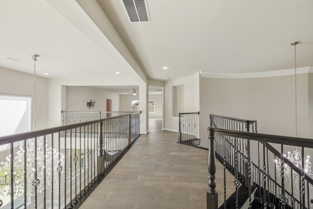 26406 Crimson Bluff Ln, Katy, TX 77494 - hallway with baseboards, recessed lighting, an upstairs landing, visible vents, and wood finished floors