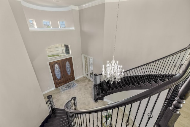 26406 Crimson Bluff Ln, Katy, TX 77494 - foyer with a towering ceiling, a notable chandelier, baseboards, ornamental molding, and stairway