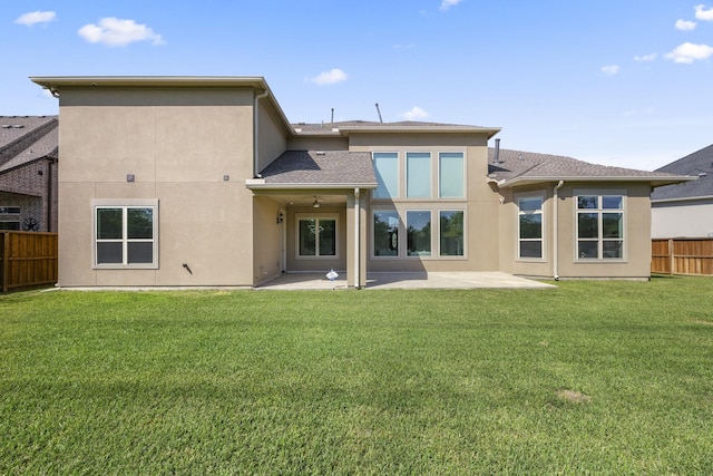 26406 Crimson Bluff Ln, Katy, TX 77494 - back of house with a yard, fence, a patio area, and stucco siding