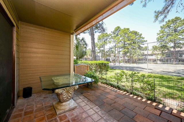 view of patio featuring fence