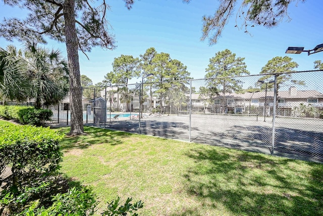 exterior space featuring a yard and fence