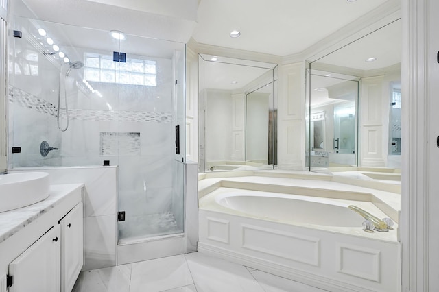 full bath featuring a stall shower, a garden tub, and vanity