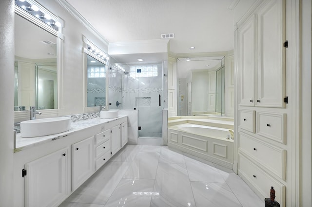bathroom with a garden tub, visible vents, a sink, and a stall shower