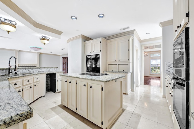 kitchen featuring visible vents, a sink, ornamental molding, black appliances, and backsplash