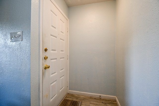10555 Turtlewood Ct Unit 2606, Houston, TX 77072 - entryway with baseboards and wood finished floors