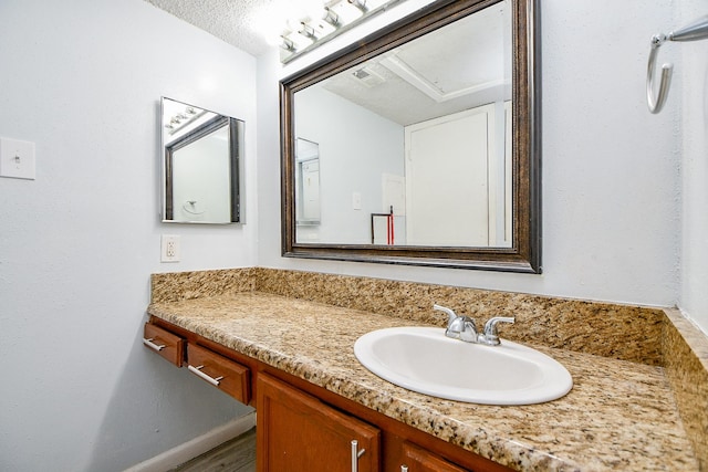 10555 Turtlewood Ct Unit 2606, Houston, TX 77072 - bathroom with vanity, visible vents, and wood finished floors