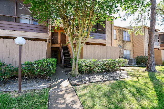 10555 Turtlewood Ct Unit 2606, Houston, TX 77072 - exterior space featuring fence, central AC unit, and a lawn