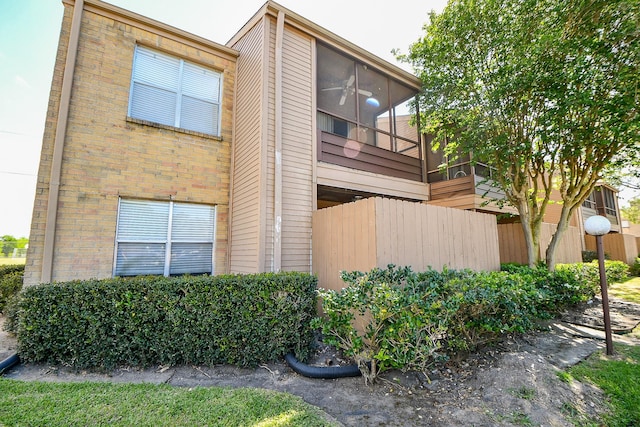 10555 Turtlewood Ct Unit 2606, Houston, TX 77072 - view of property exterior with brick siding and fence