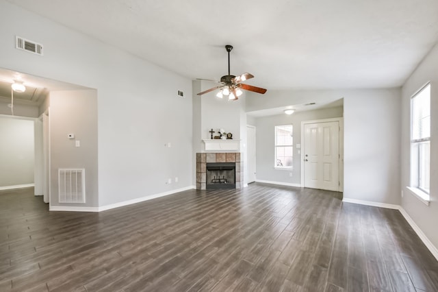 27806 Red Fox Rd, Tomball, TX 77377 - unfurnished living room with dark wood-type flooring, visible vents, baseboards, and a ceiling fan