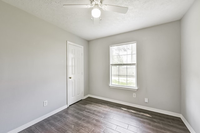 27806 Red Fox Rd, Tomball, TX 77377 - empty room featuring ceiling fan, a textured ceiling, dark wood-style flooring, and baseboards