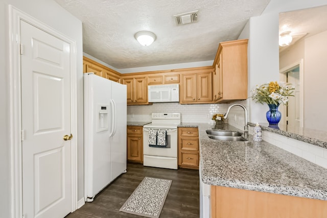 27806 Red Fox Rd, Tomball, TX 77377 - kitchen featuring dark wood finished floors, light stone countertops, white appliances, visible vents, and a sink