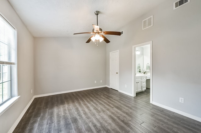 27806 Red Fox Rd, Tomball, TX 77377 - empty room with visible vents, baseboards, a ceiling fan, and dark wood-style floors