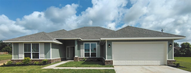 9 Gemstone Ct, Angleton, TX 77515 - view of front of property featuring driveway, a garage, a front yard, brick siding, and a shingled roof