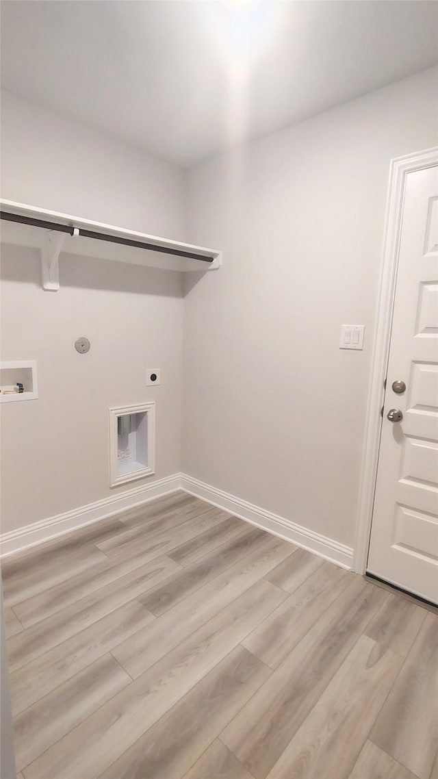 9 Gemstone Ct, Angleton, TX 77515 - laundry area featuring light wood finished floors, hookup for a washing machine, electric dryer hookup, and baseboards