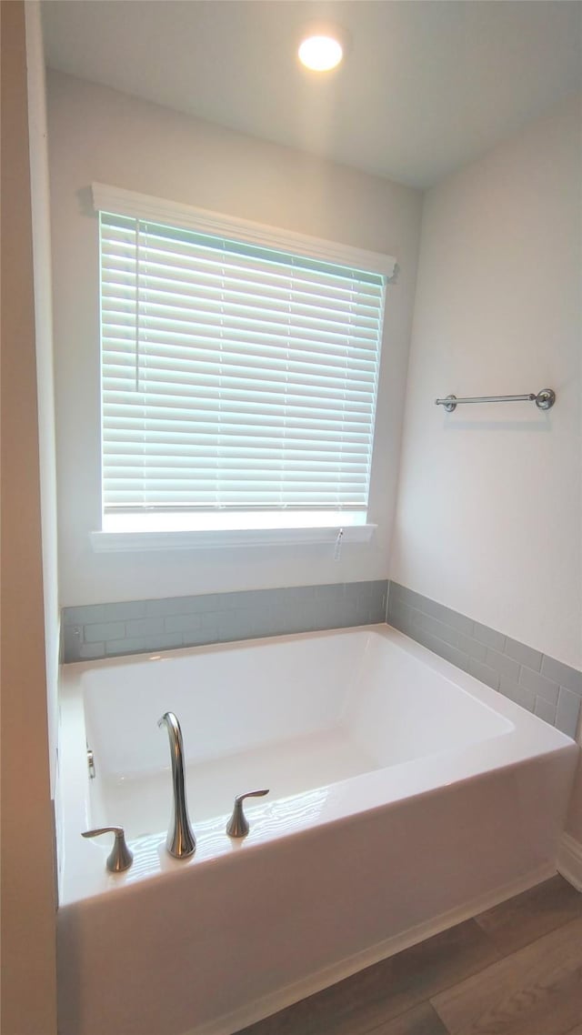 9 Gemstone Ct, Angleton, TX 77515 - full bath with a garden tub, wood finished floors, and recessed lighting