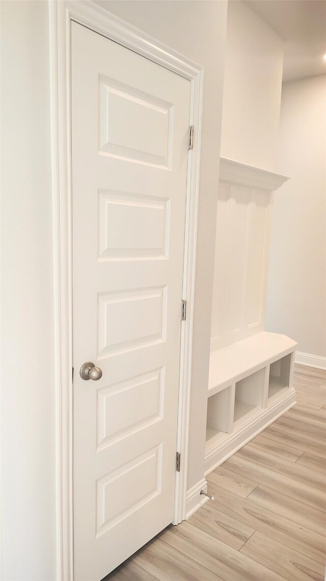 9 Gemstone Ct, Angleton, TX 77515 - mudroom featuring light wood-style flooring and baseboards