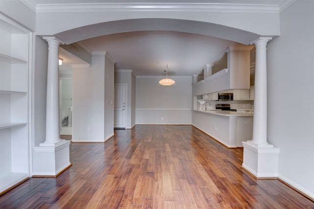 2111 Welch St Unit A107, Houston, TX 77019 - unfurnished living room featuring wood finished floors, a sink, crown molding, baseboards, and built in features