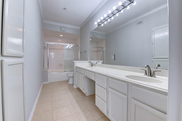 2111 Welch St Unit A107, Houston, TX 77019 - bathroom featuring ornamental molding, tile patterned flooring, double vanity, combined bath / shower with glass door, and toilet
