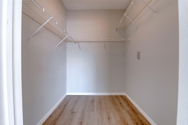 2111 Welch St Unit A107, Houston, TX 77019 - walk in closet featuring light wood-style floors