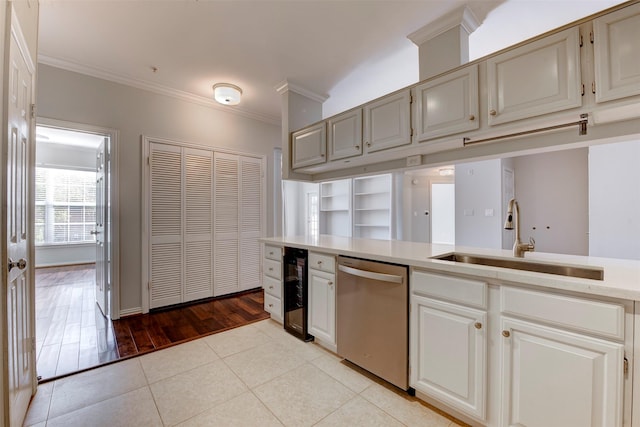 2111 Welch St Unit A107, Houston, TX 77019 - kitchen featuring dishwasher, a sink, crown molding, beverage cooler, and light tile patterned floors
