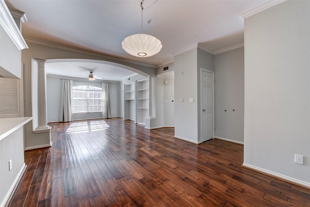 2111 Welch St Unit A107, Houston, TX 77019 - unfurnished dining area with decorative columns, a ceiling fan, arched walkways, dark wood finished floors, and crown molding