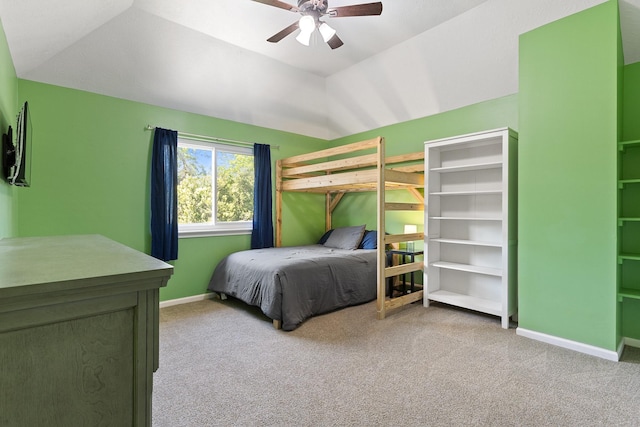 bedroom featuring light carpet, baseboards, a ceiling fan, and lofted ceiling