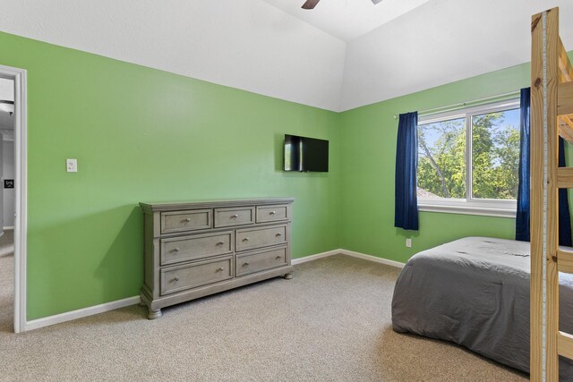 carpeted bedroom with baseboards, a ceiling fan, and lofted ceiling