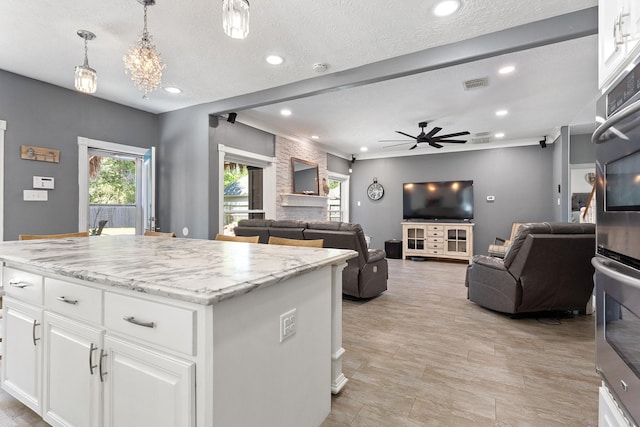 kitchen with plenty of natural light, recessed lighting, visible vents, and ceiling fan
