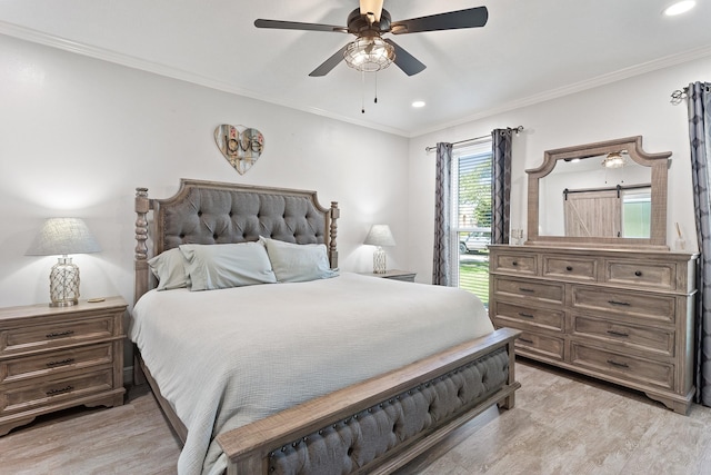 bedroom featuring crown molding, light wood finished floors, and recessed lighting