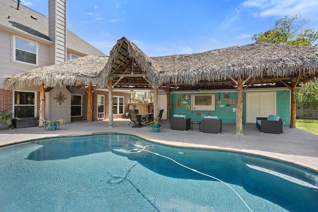 pool featuring a patio area, outdoor lounge area, and a gazebo