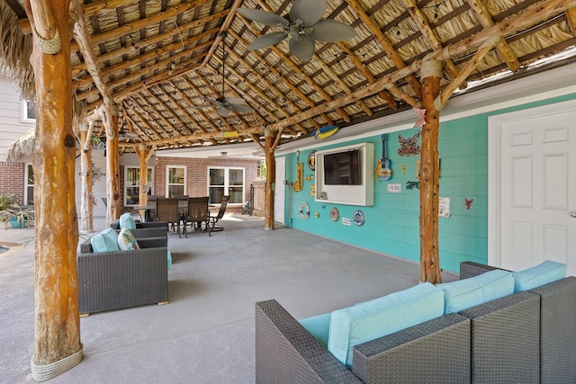 view of patio with outdoor dining area, an outdoor hangout area, and ceiling fan