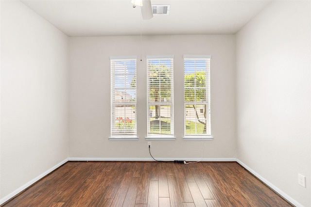 2451 Porto Way, League City, TX 77573 - empty room with visible vents, baseboards, a ceiling fan, and dark wood finished floors