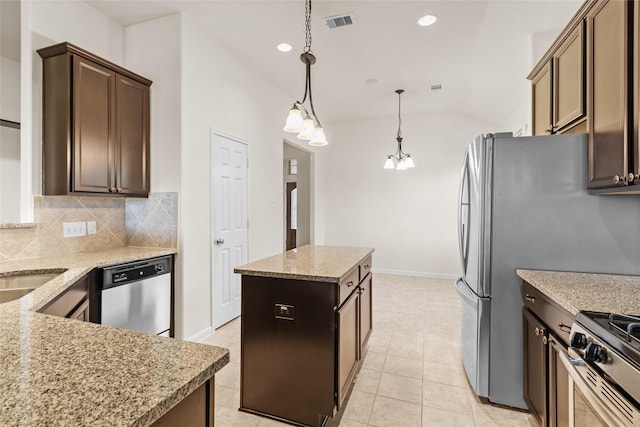 2451 Porto Way, League City, TX 77573 - kitchen with recessed lighting, a center island, backsplash, visible vents, and stainless steel appliances
