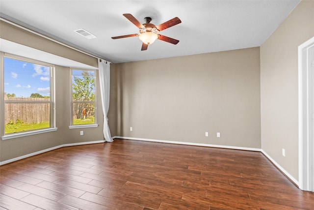 2451 Porto Way, League City, TX 77573 - unfurnished room with visible vents, baseboards, a ceiling fan, and wood finished floors