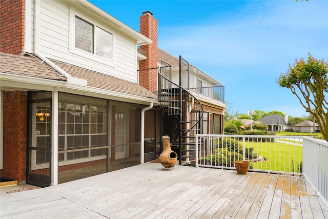 deck with a yard and stairway