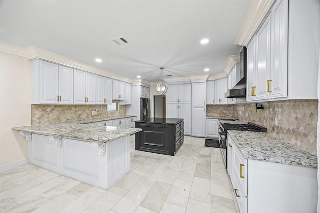 509 Joan Of Arc Dr, Hempstead, TX 77445 - kitchen with a sink, stainless steel gas range, fridge with ice dispenser, light stone countertops, and decorative backsplash