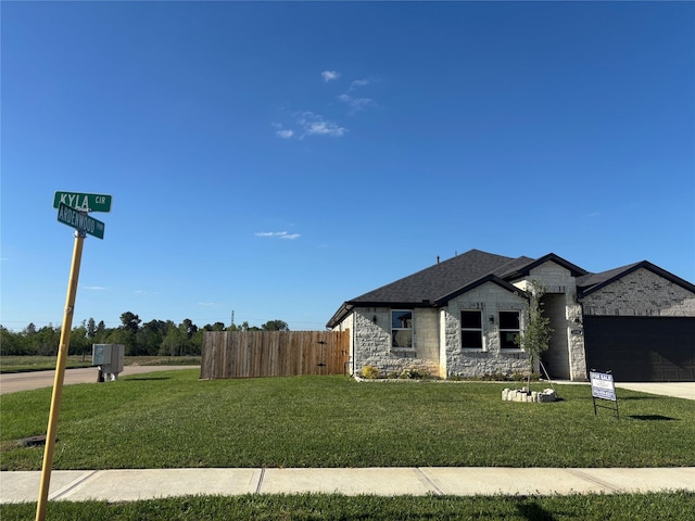 5398 Kyla Cir, Katy, TX 77493 - view of front of house with fence, a front lawn, stone siding, a garage, and concrete driveway