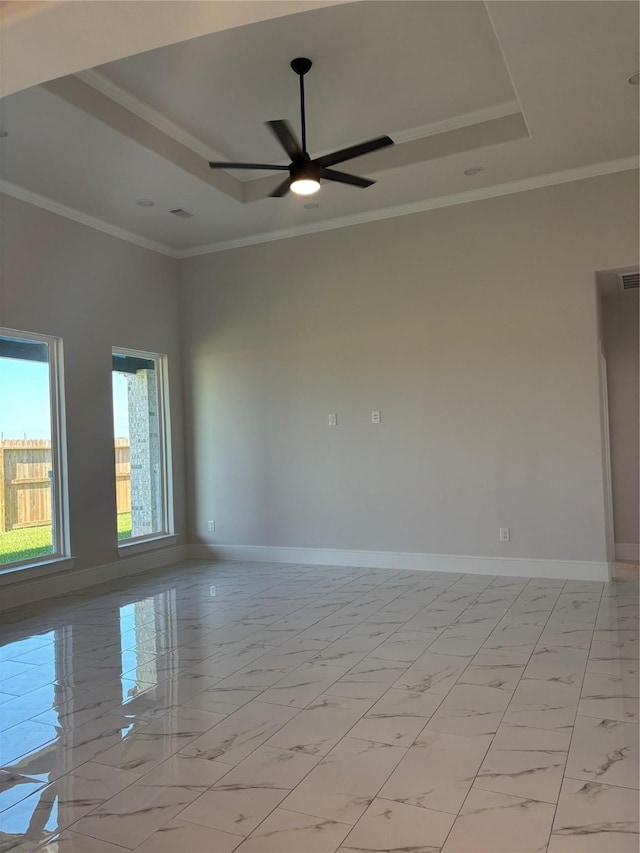 5398 Kyla Cir, Katy, TX 77493 - empty room with baseboards, marble finish floor, ceiling fan, and a tray ceiling