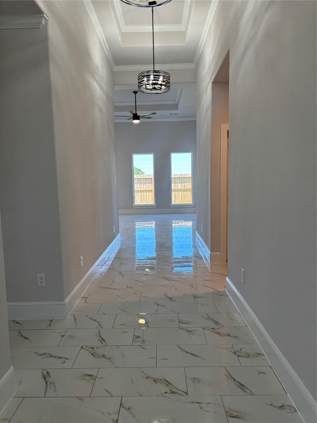 5398 Kyla Cir, Katy, TX 77493 - hall featuring a tray ceiling, ornamental molding, baseboards, and marble finish floor