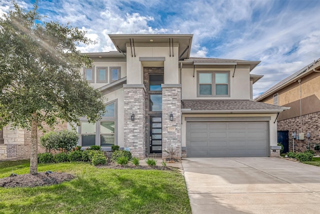 2327 Pumpkin Patch Ln, Richmond, TX 77406 - prairie-style home with stucco siding, concrete driveway, a garage, and a front yard