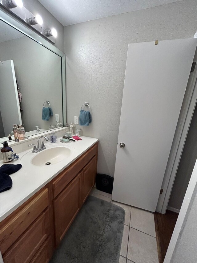 bathroom with vanity and tile patterned floors